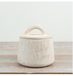 Enhance your space with textured elegance and practical storage in this stylish lidded jar