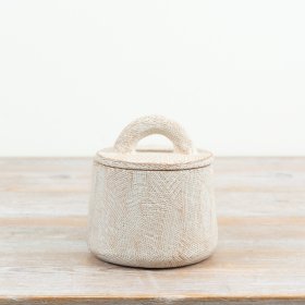 Enhance your home with this beautifully textured and sculptural cement pot featuring a practical lid