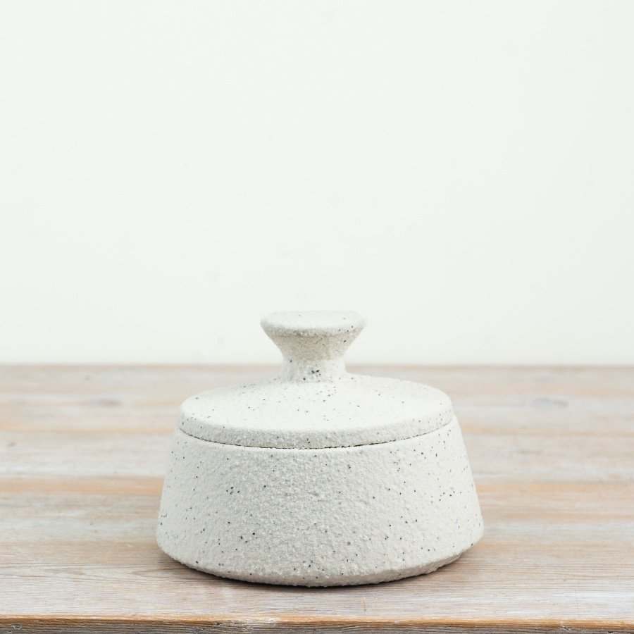a stylish white storage jar with convenient lid ideal for organising your small bits and bobs