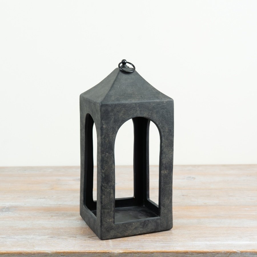 a charming rustic lantern with a distressed black finish