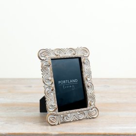 a beautifully crafted shabby chic frame with intricate detailing