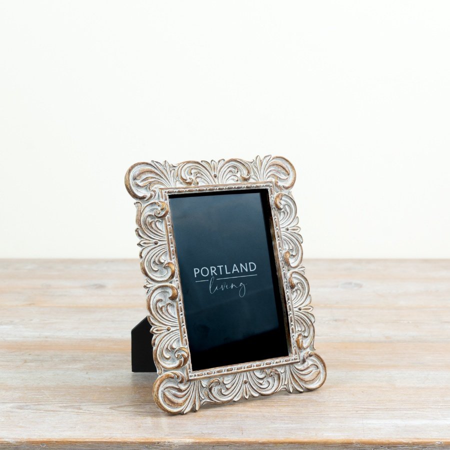 a beautifully crafted shabby chic frame with intricate detailing