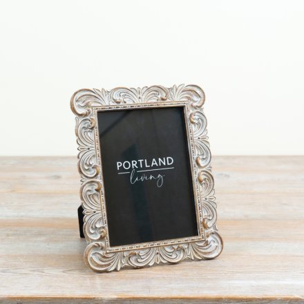 a delightful freestanding frame with ornate detailing