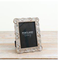 a delightful freestanding frame with ornate detailing