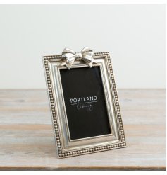 a stylish silver bow style photo frame 