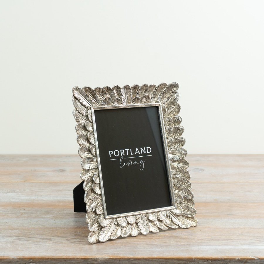 elegant feather-inspired frame with a sleek silver finish