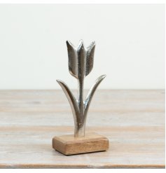 Elegant aluminium tulip flower on a natural wood base inspired by the beauty of nature