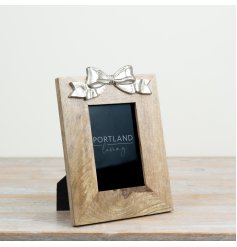 a rustic wooden photo frame with as stylish bow on top
