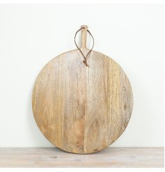 Natural wood chopping board with rustic charm and handy leather loop for easy storage