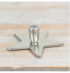 a charming star shaped candle holder perfect fro taper candles 