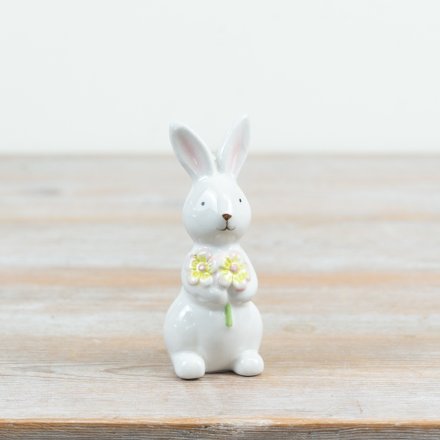 a sweet bunny figurine with flowers
