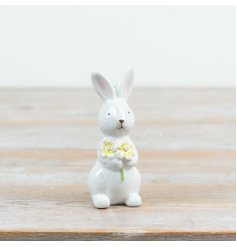 a sweet bunny figurine with flowers