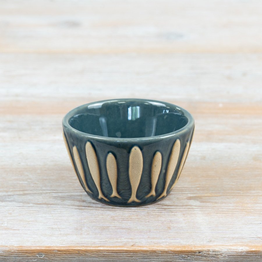 Delightful porcelain dip bowl showcasing a stylish shoal of fish pattern for everyday use