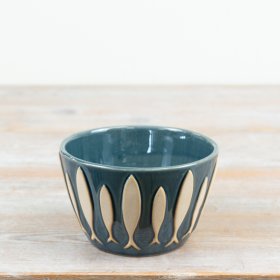 infuse your table setting with seaside elegance using this beautiful fish-themed dip bowl