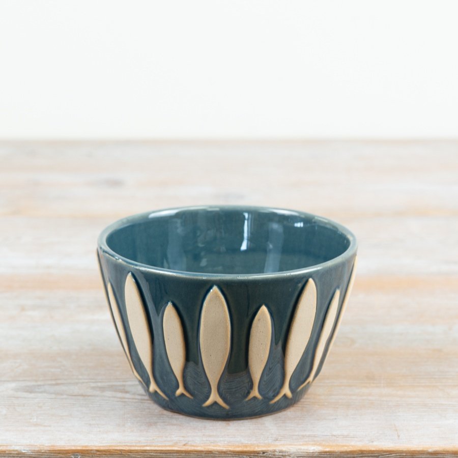 infuse your table setting with seaside elegance using this beautiful fish-themed dip bowl