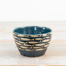 Elegant coastal-inspired bowl adorned with a charming shoal of blue fish pattern