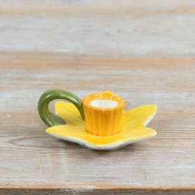 delightful candle holder inspired by spring daffodils with layered yellow petals and distinctive trumpet centre
