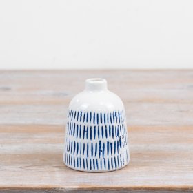 Add a touch of charm to your surfaces with this delightful bud vase