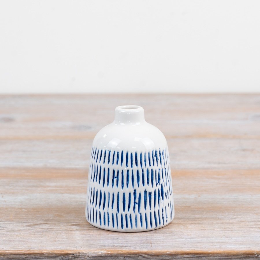 Add a touch of charm to your surfaces with this delightful bud vase