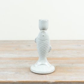 Delightful fish-shaped candle holder with a smooth white glazed finish
