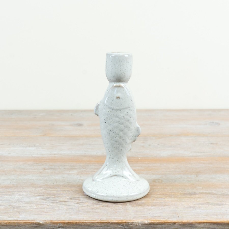 Delightful fish-shaped candle holder with a smooth white glazed finish