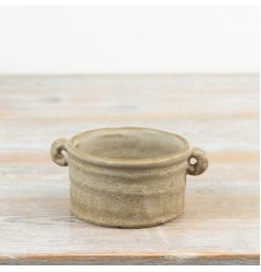 a rustic planter with 2 handy handles for transporting 