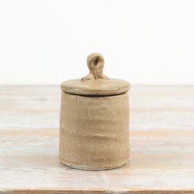 Charming rustic ceramic jar perfect for stylish storage and utensil organisation