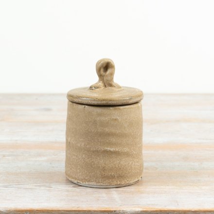a simple but elegant natural tone storage jar 