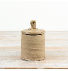 a simple but elegant natural tone storage jar 