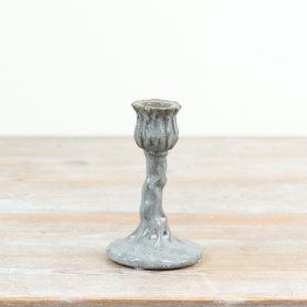 a charming bud-shaped cup perched atop a vine-textured, organic stem