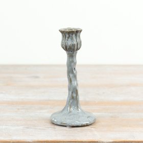 Elegant tall taper candle holder with a graceful flower motif