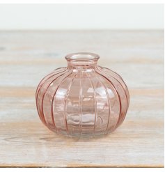 a small charming pastel pink bottle vase 