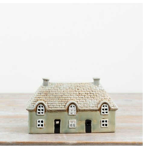 Create a cosy ambience with the gentle flicker of this delightful candle house