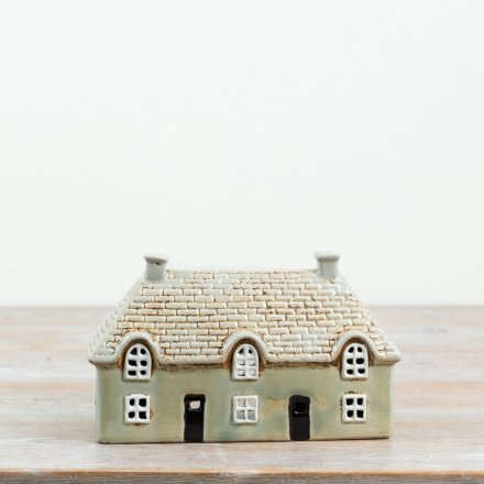 Add a warm, welcoming glow to your favourite  space with this candle house