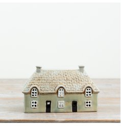 Add a warm, welcoming glow to your favourite  space with this candle house