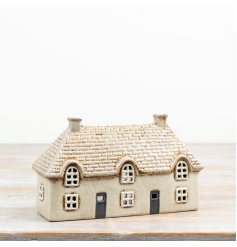Add a warm, welcoming glow to your favourite  space with this candle house.