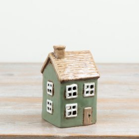 Delightful rustic candle house featuring a detailed thatched effect roof