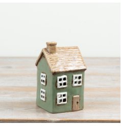 Delightful rustic candle house featuring a thatched roof detail for a cosy ambience