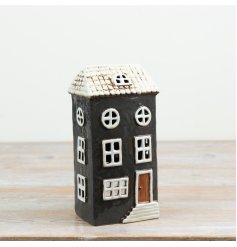 Bring Scandinavian-inspired warmth to your living space with this cottage  tea light holder 