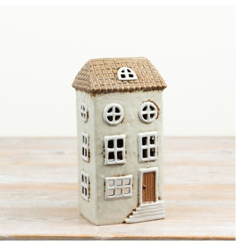 a delightful rustic multi-level candle house with hand-finished details