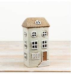 a delightful rustic-style candle house with charming hand-distressed details