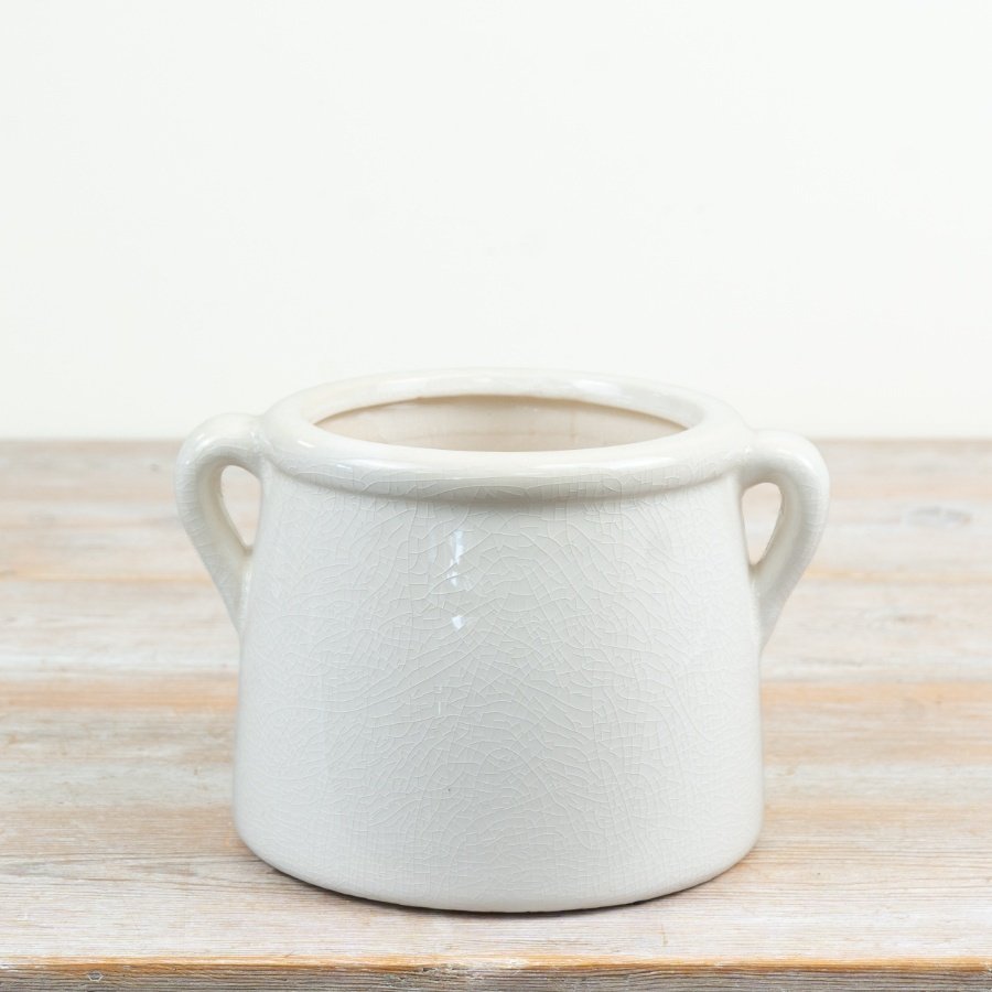 elegant white planter pot with convenient side handles for easy movement