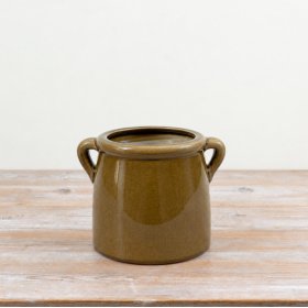 A glossy, deep green planter with practical handles for effortless style