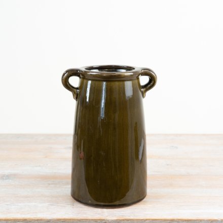 a charming vase  coated in a high-gloss, deep olive green 