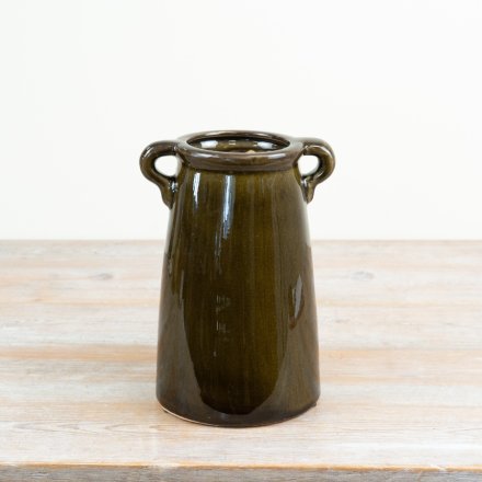a charming deep green vase with handles 