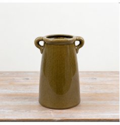 a charming deep green vase with handles 