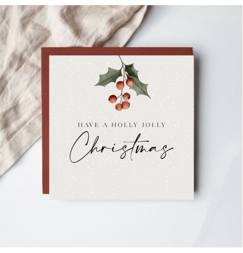 Share joyful festive greetings with this delightful holly-decorated Christmas card