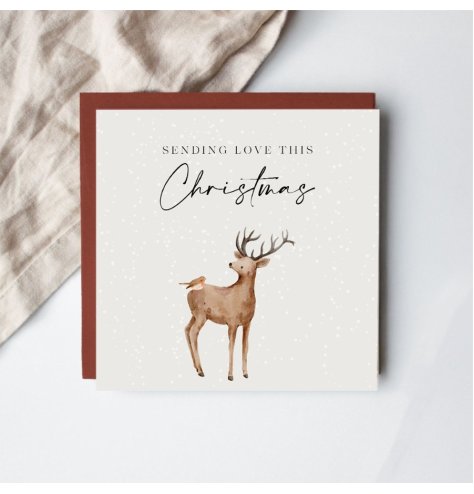 a delightful stag and robin motif Christmas card