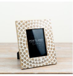 a delightful photo frame featuring a heart-shaped wooden design