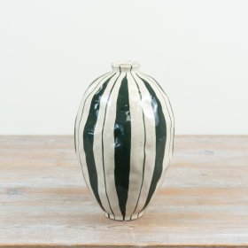 an elegant striped vase that adds a touch of charm